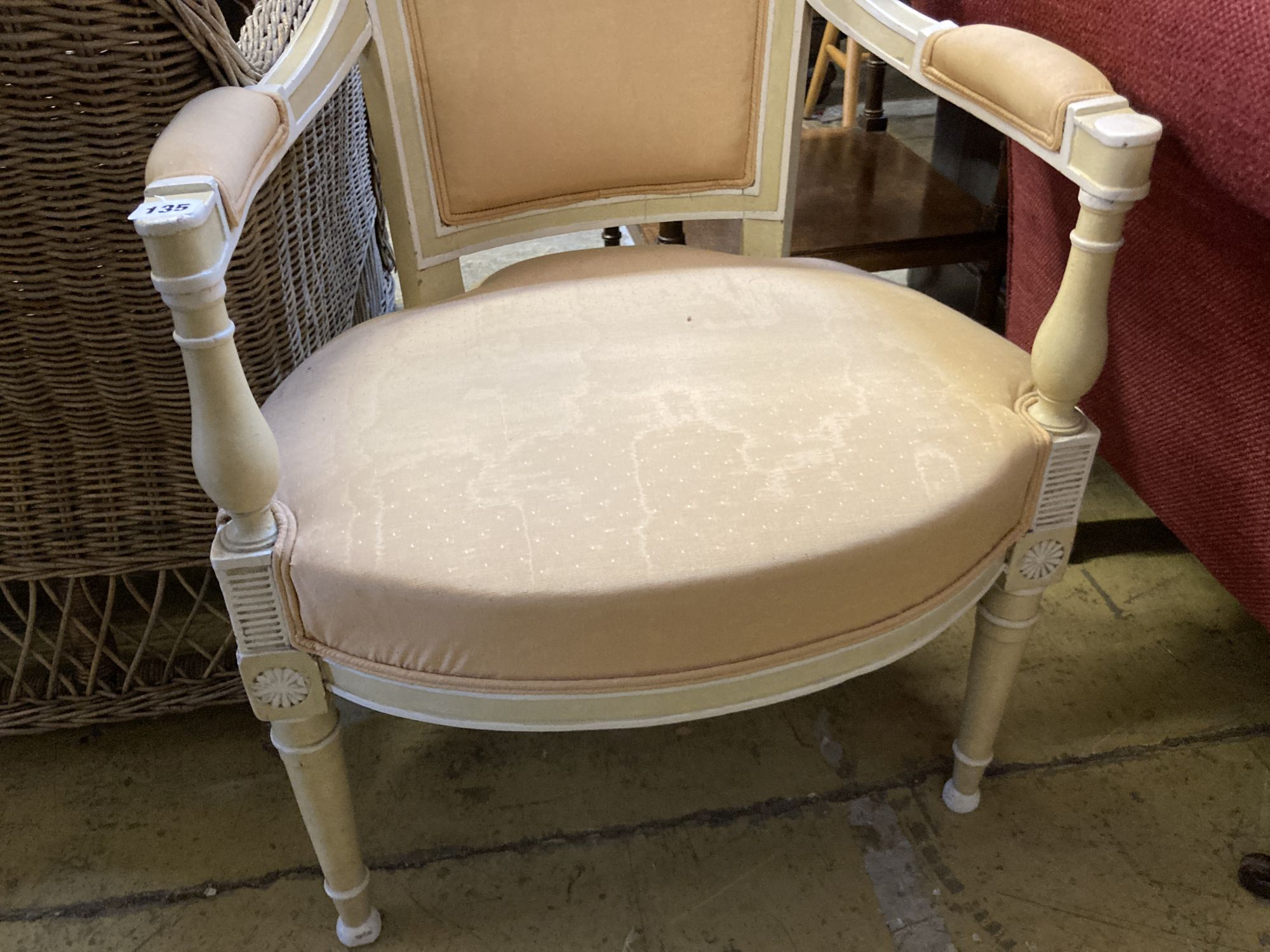 A Louis XVI style cream and white painted fauteuil, width 56cm, depth 48cm, height 88cm